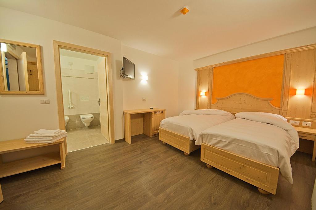 Postel nebo postele na pokoji v ubytování Hotel Niagara