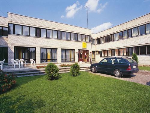 a car parked in front of a building at Jäneda Guesthouse in Jäneda