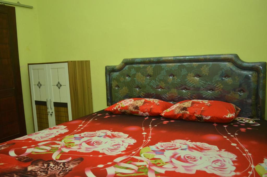 Postel nebo postele na pokoji v ubytování Sritanjung Homestay