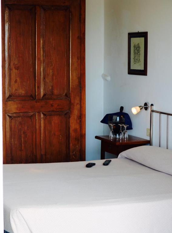 Postel nebo postele na pokoji v ubytování Hotel Rizieri