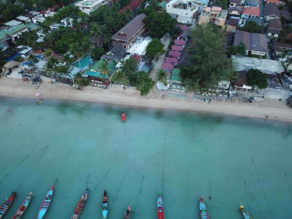 an aerial view of a beach with boats in the water at Grand Beach Resort in Ko Tao
