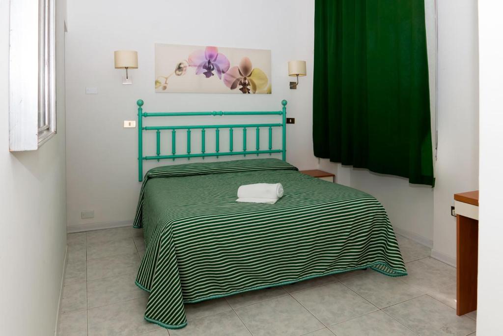 Postel nebo postele na pokoji v ubytování Affittacamere Orchidea