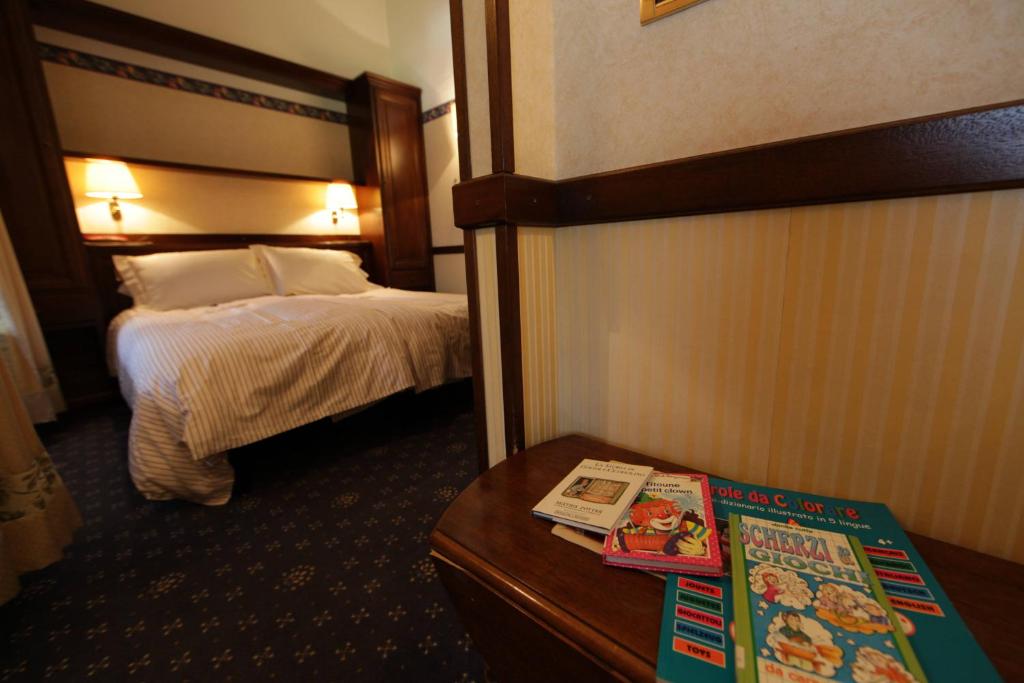 Postel nebo postele na pokoji v ubytování Hotel Petit Prince