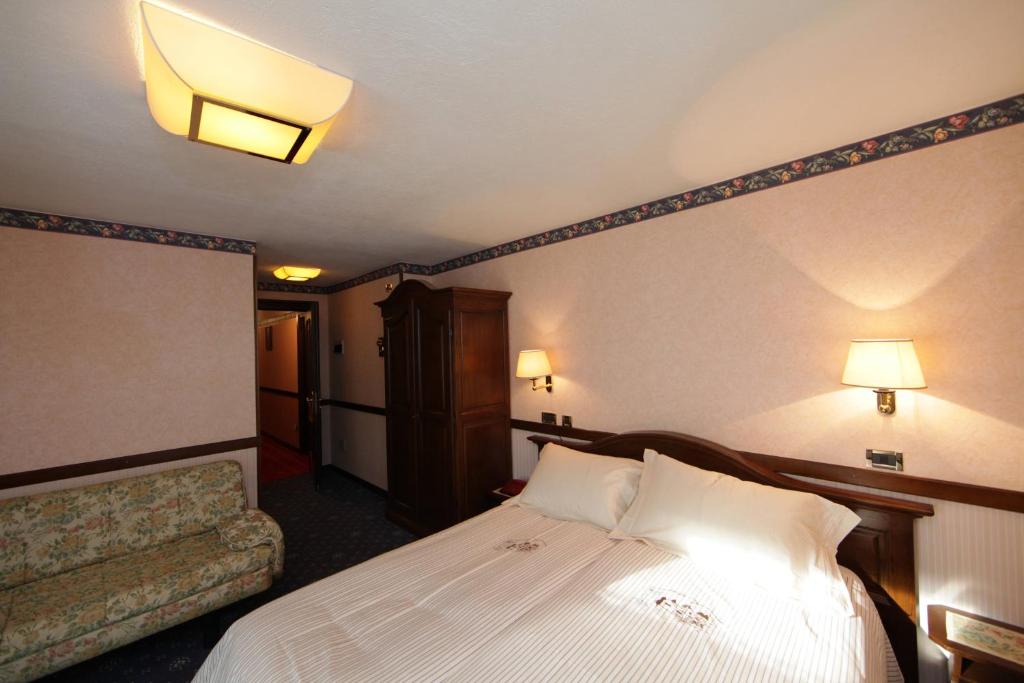Postel nebo postele na pokoji v ubytování Hotel Petit Prince