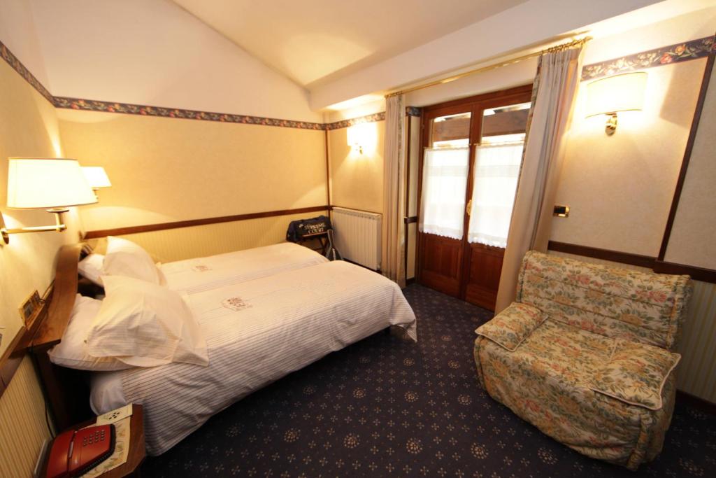 Postel nebo postele na pokoji v ubytování Hotel Petit Prince