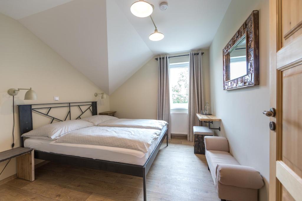 Postel nebo postele na pokoji v ubytování Smrcina Resort
