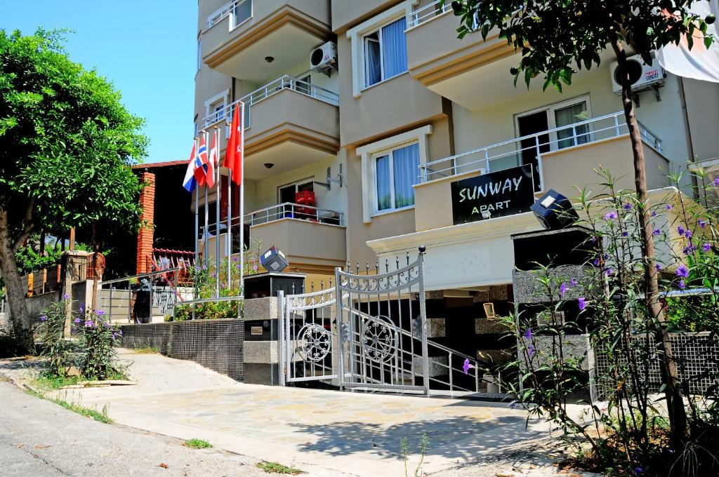 a building with a sign for a hotel at Sunway Apart Hotel in Alanya