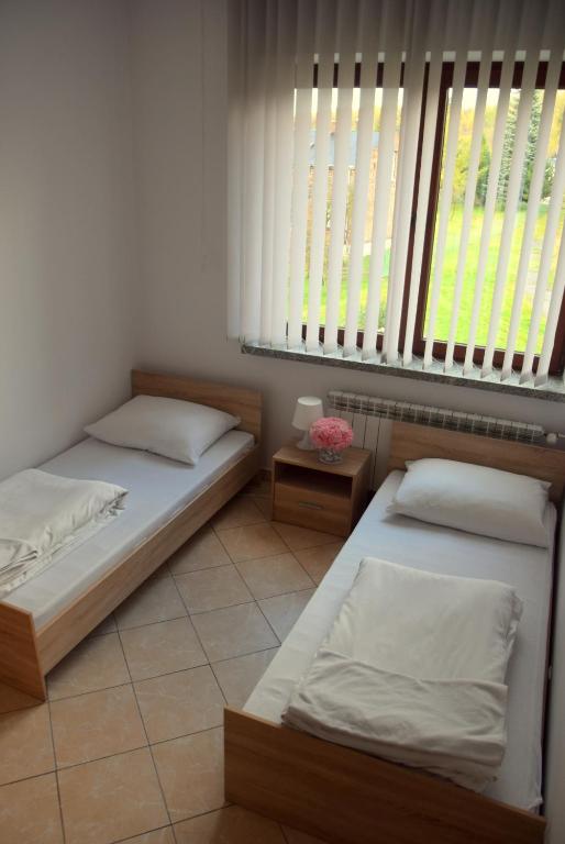 Posteľ alebo postele v izbe v ubytovaní Zajazd Kwadrat