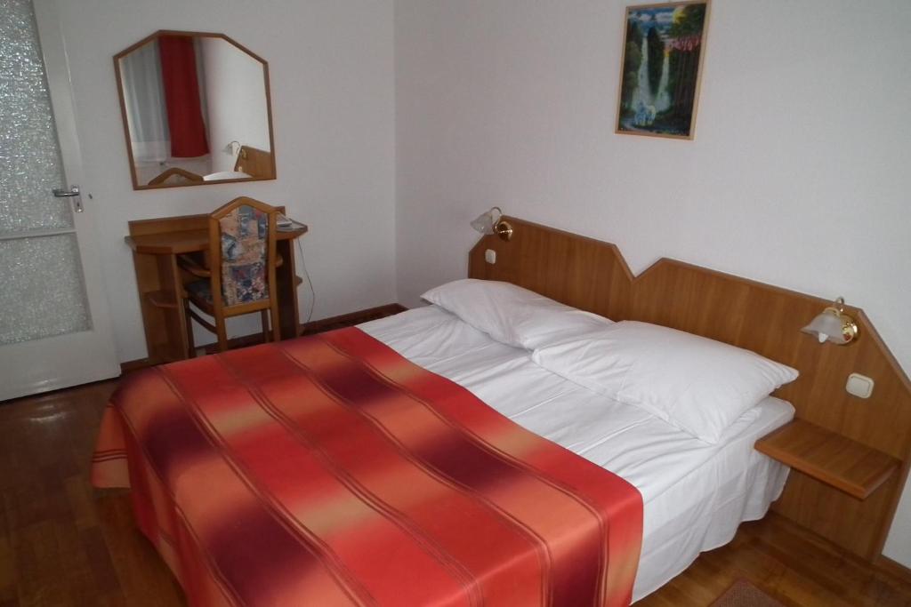 Postel nebo postele na pokoji v ubytování Hotel Napsugar