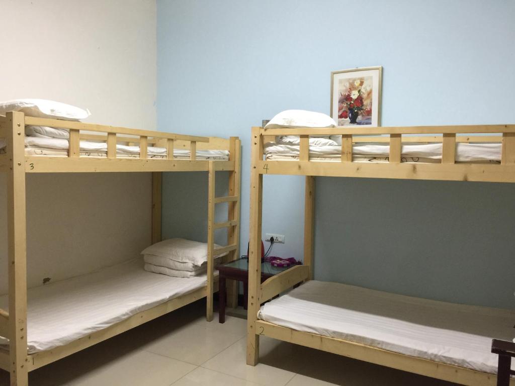 Postel nebo postele na pokoji v ubytování Huashan Gehui Hotel