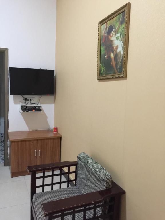 TV a/nebo společenská místnost v ubytování Huashan Gehui Hotel