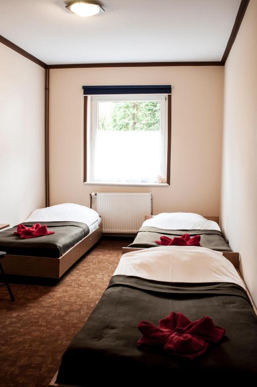 Postel nebo postele na pokoji v ubytování Gościniec Silver