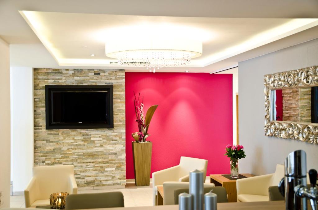 TV a/nebo společenská místnost v ubytování Hotel Garni Alpenland