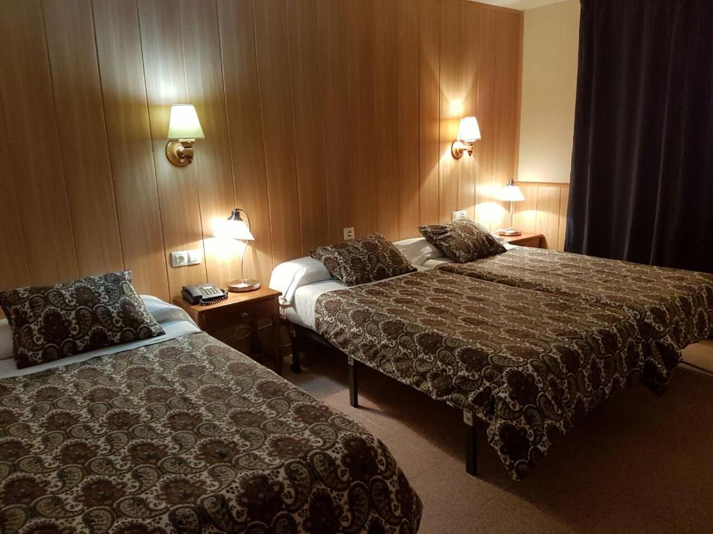 Postel nebo postele na pokoji v ubytování Hotel Comapedrosa