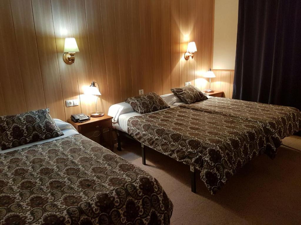 Postel nebo postele na pokoji v ubytování Hotel Comapedrosa