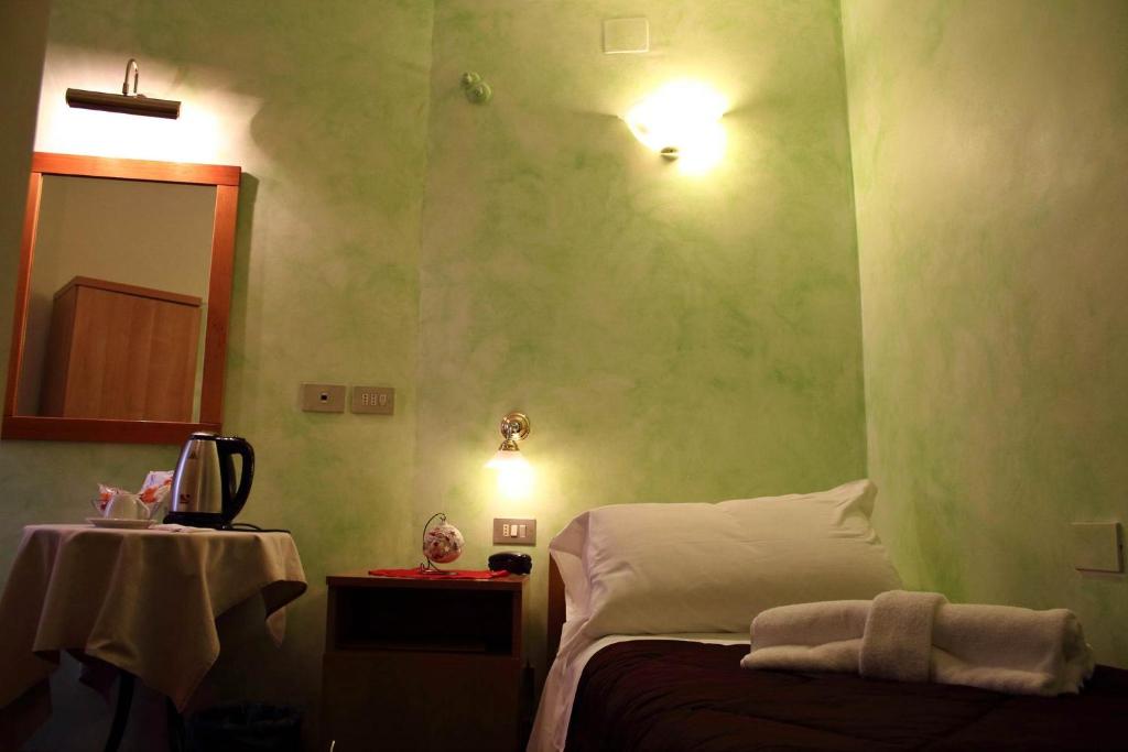 Postel nebo postele na pokoji v ubytování Primavera Mini Hotel