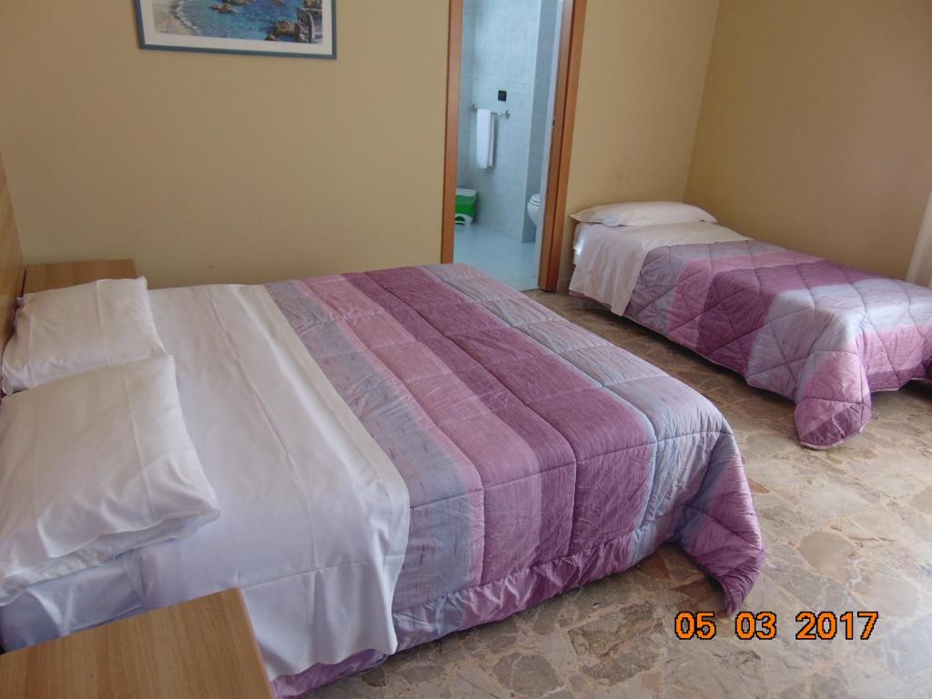 Postel nebo postele na pokoji v ubytování Hotel Mazzocchetti