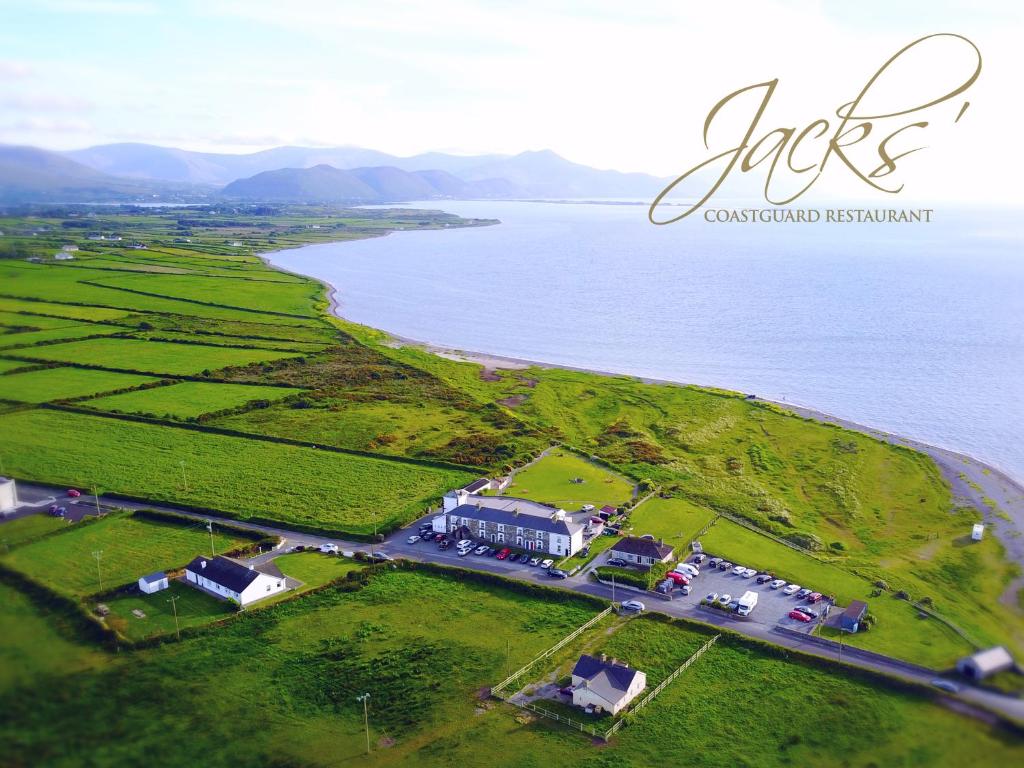 an aerial view of a house next to the water at Jacks' Coastguard Cottage Vacation home in Glenbeigh