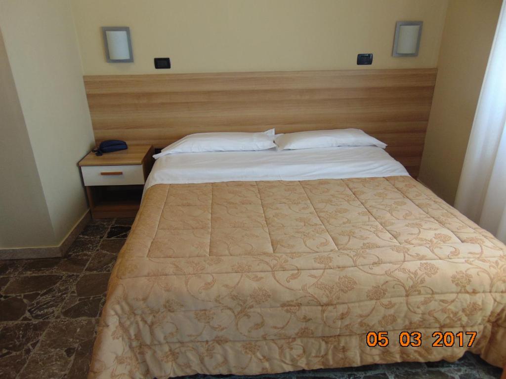 Postel nebo postele na pokoji v ubytování Hotel Mazzocchetti