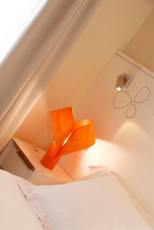 Postel nebo postele na pokoji v ubytování Hostal riMboMbin