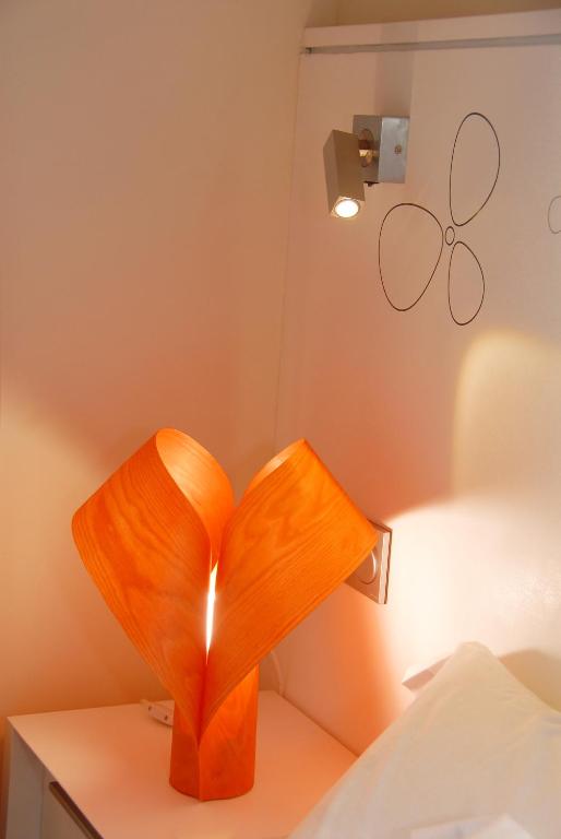 Postel nebo postele na pokoji v ubytování Hostal riMboMbin