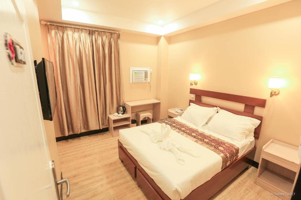 Postel nebo postele na pokoji v ubytování Southview Hotel