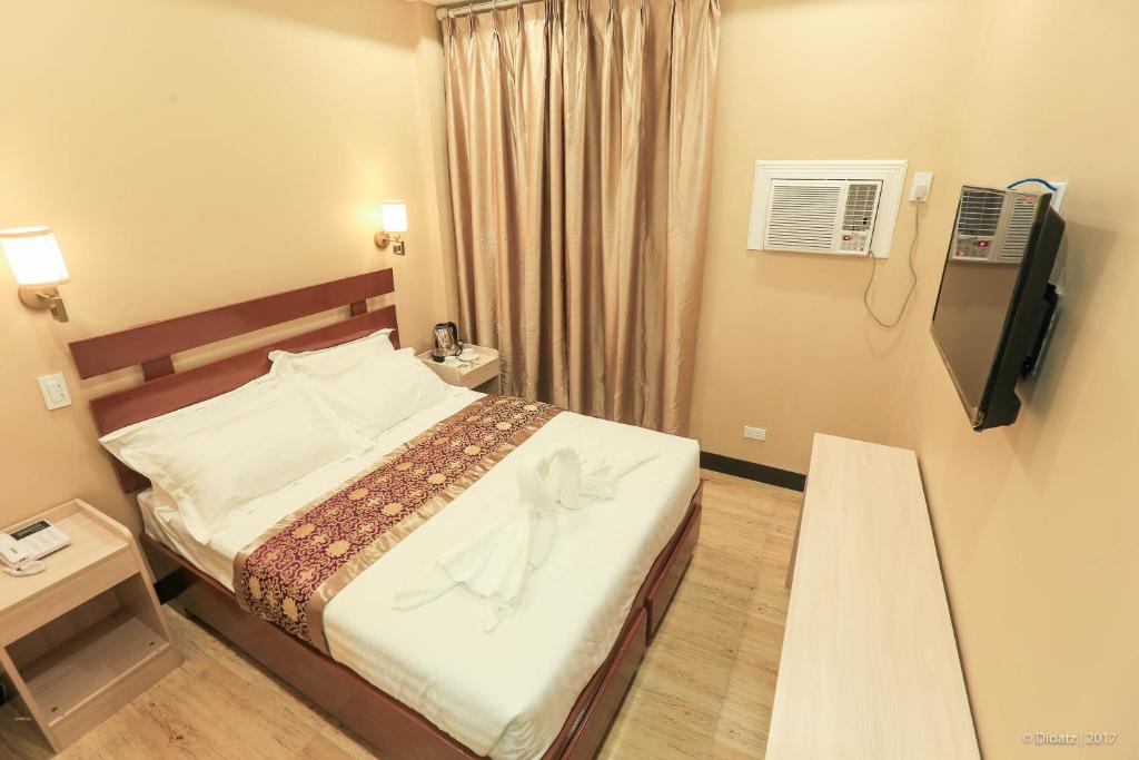 Postel nebo postele na pokoji v ubytování Southview Hotel