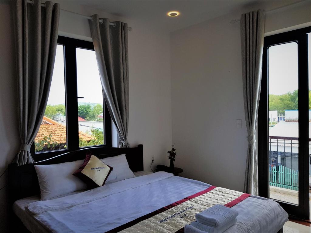 Postel nebo postele na pokoji v ubytování Hung Vuong Resort