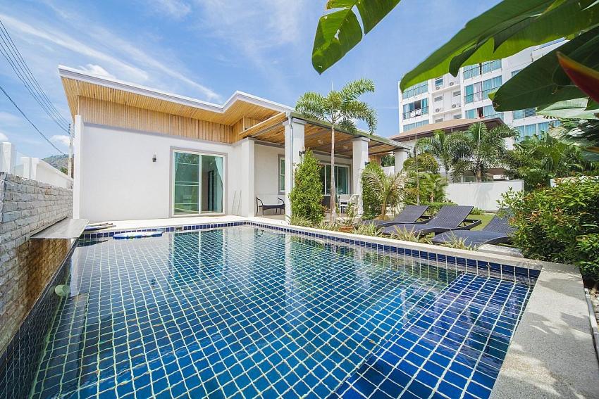 a swimming pool in front of a house at VILLA CHELONI 2 BEDROOMS in Kamala Beach