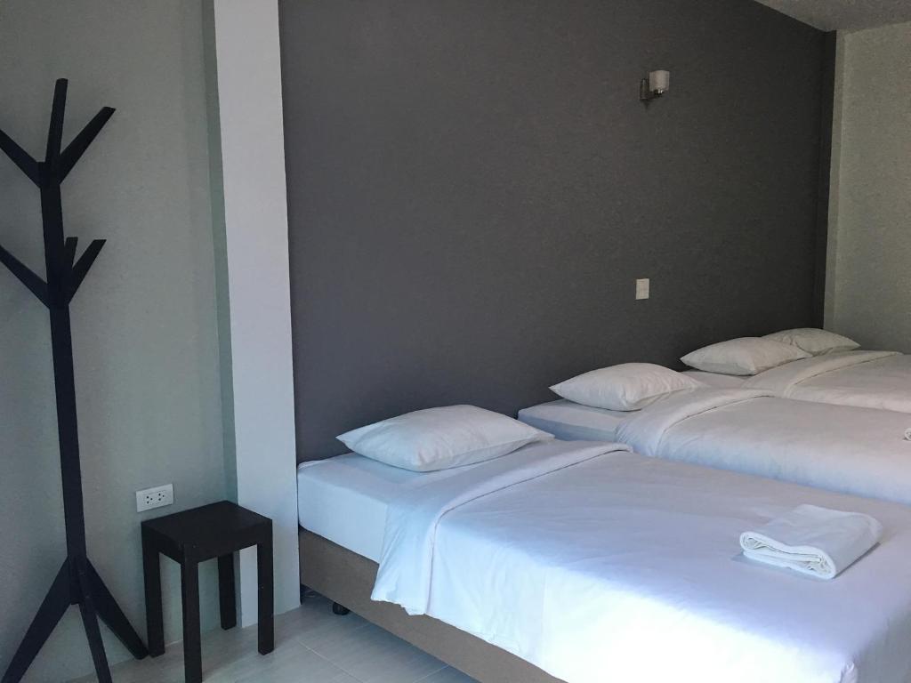 Postel nebo postele na pokoji v ubytování Ban Krut Resort