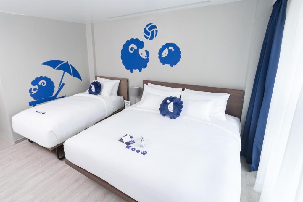 Postel nebo postele na pokoji v ubytování Kokotel Krabi Oasis