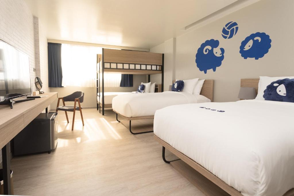 Postel nebo postele na pokoji v ubytování Kokotel Krabi Oasis