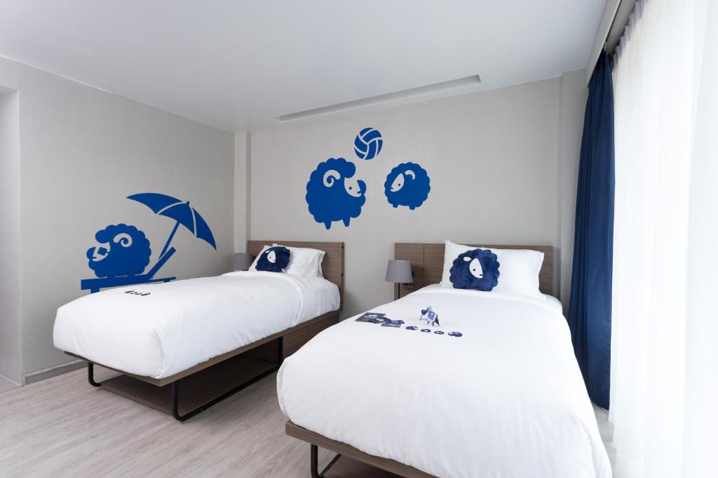 Postel nebo postele na pokoji v ubytování Kokotel Krabi Oasis
