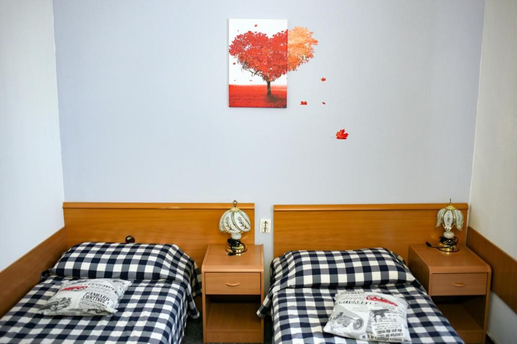 Postelja oz. postelje v sobi nastanitve Hotel Veli Jože