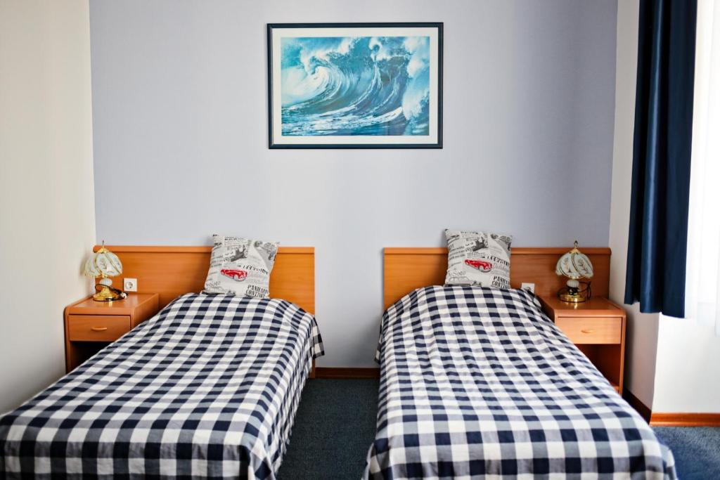 Postelja oz. postelje v sobi nastanitve Hotel Veli Jože