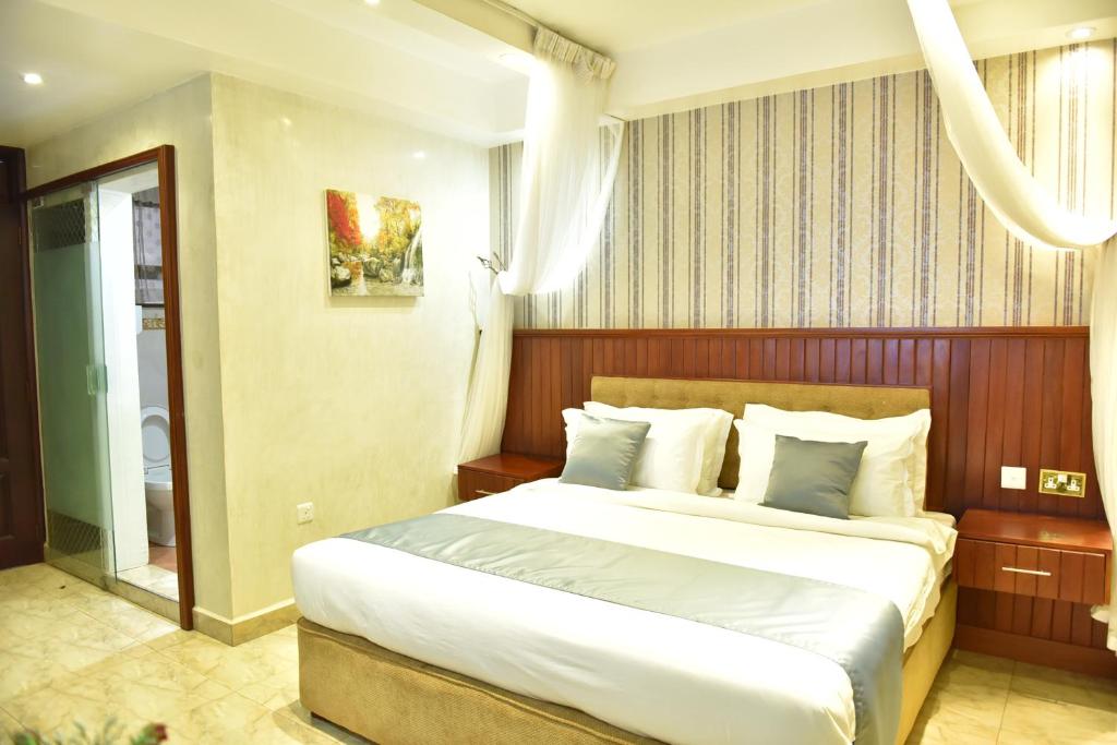 Postel nebo postele na pokoji v ubytování Interservice Hotel