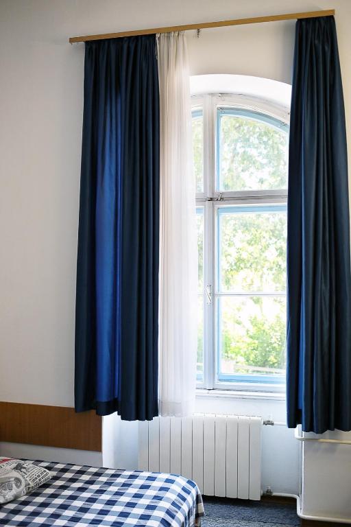 Postelja oz. postelje v sobi nastanitve Hotel Veli Jože