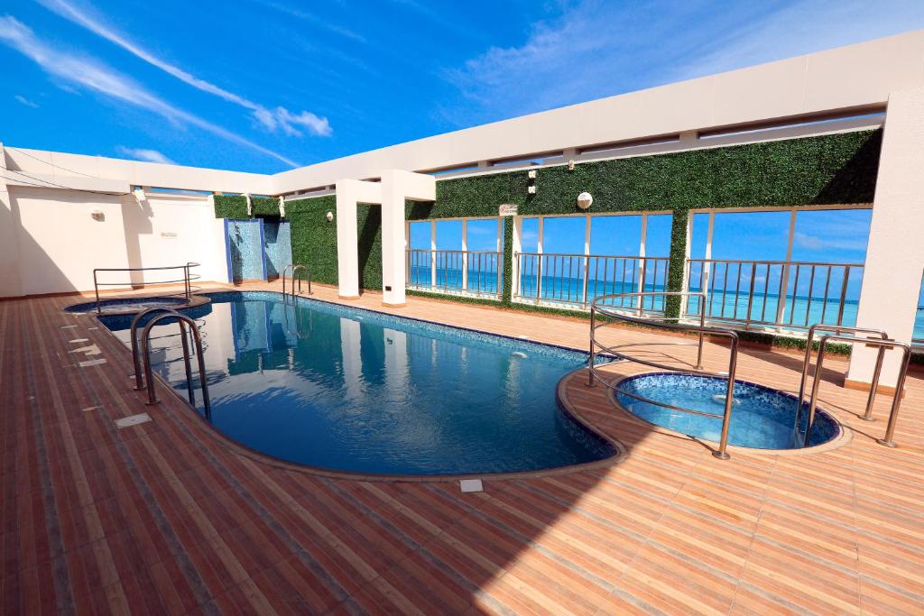 a swimming pool on the deck of a cruise ship at V Hotel Fujairah in Fujairah