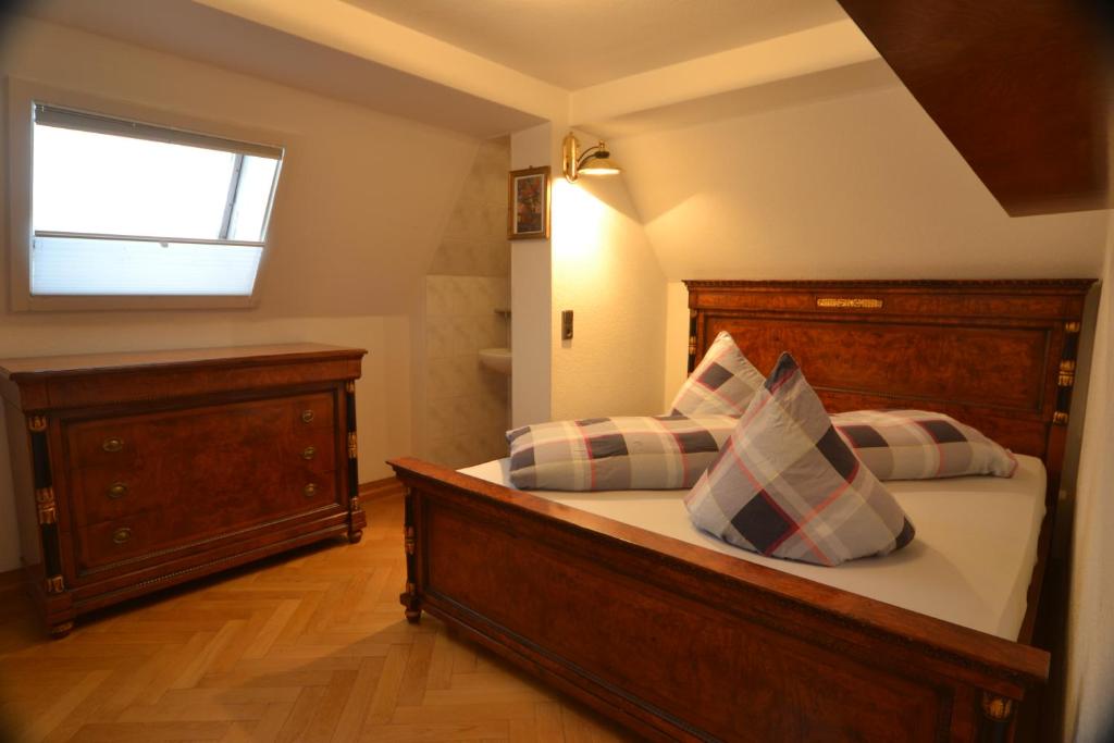 a bedroom with a bed and a window at Schwarwald Apartment in Schluchsee