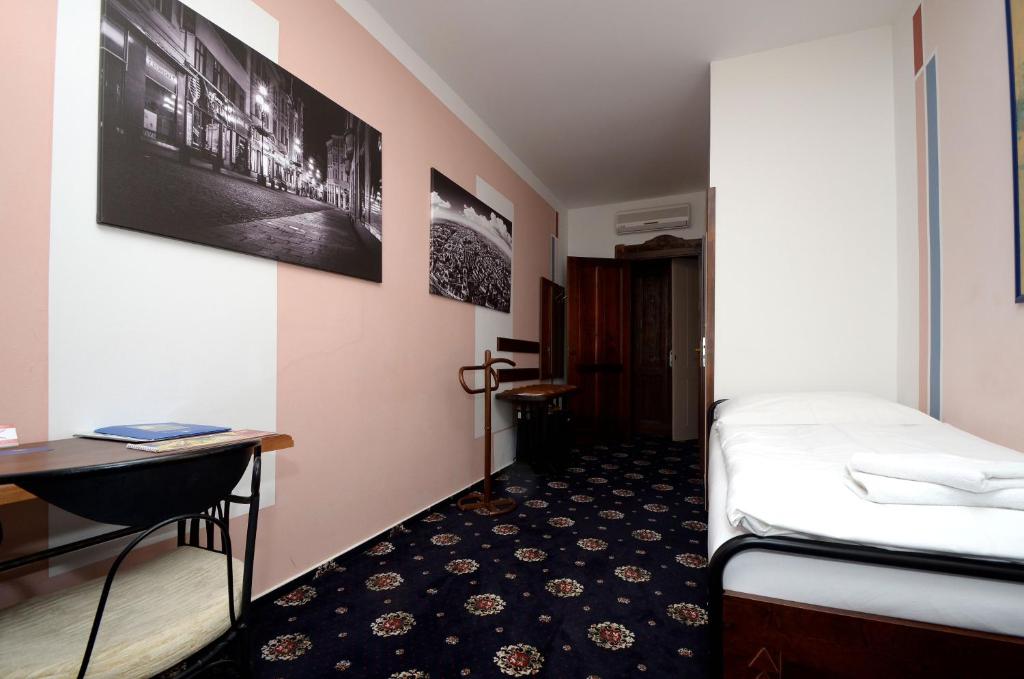 Postel nebo postele na pokoji v ubytování Brioni Boutique Hotel 4*