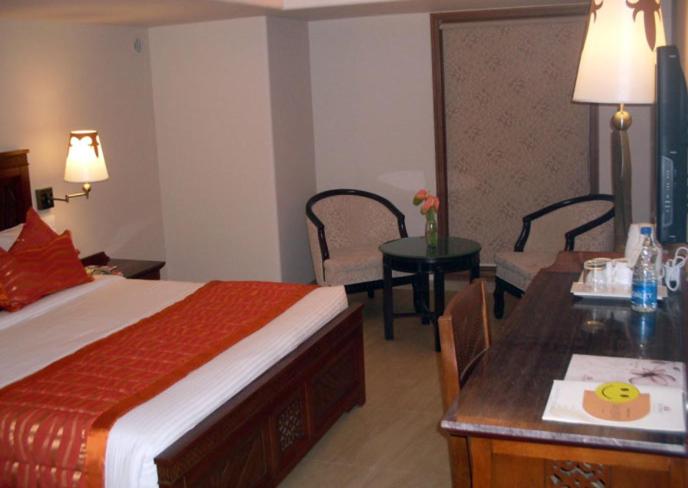 Postel nebo postele na pokoji v ubytování Hotel Sai Inn