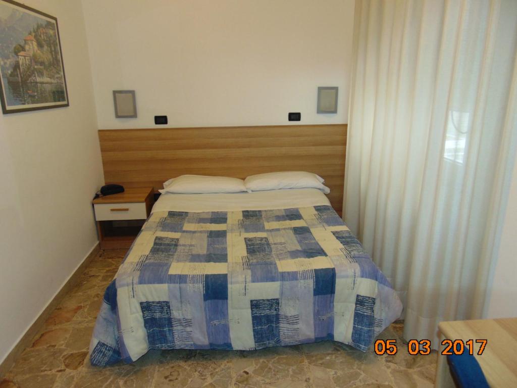 Postel nebo postele na pokoji v ubytování Hotel Mazzocchetti