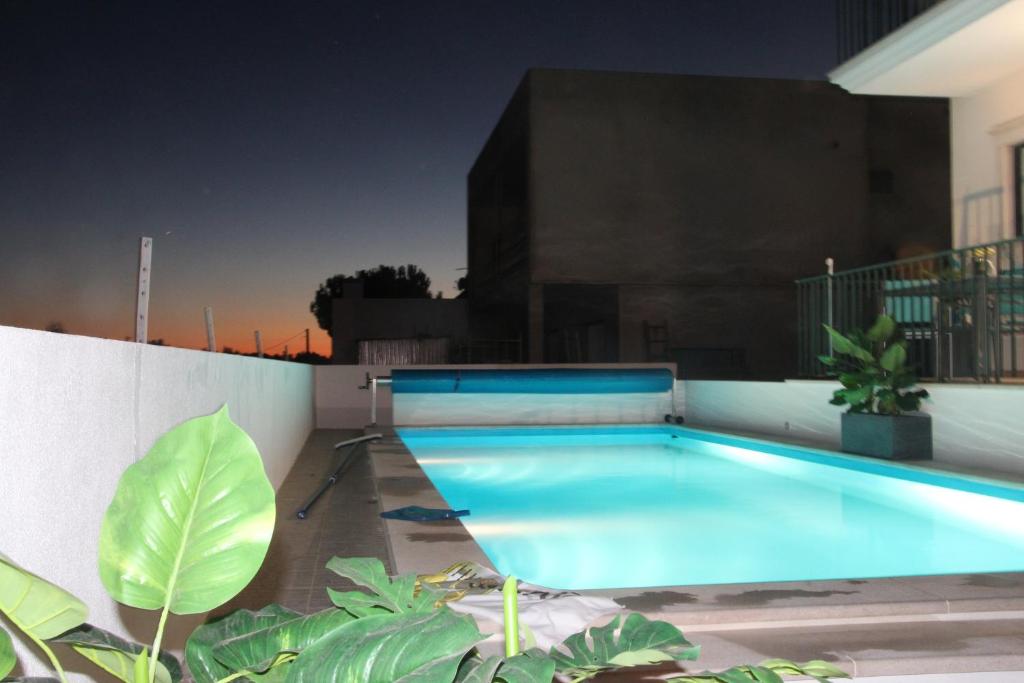 a swimming pool on the roof of a building at Olive View in Vila Nova da Barquinha
