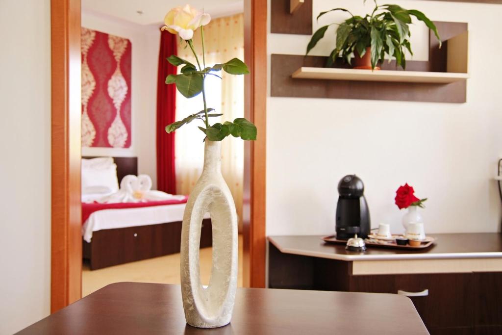 Postel nebo postele na pokoji v ubytování Silver Hotel