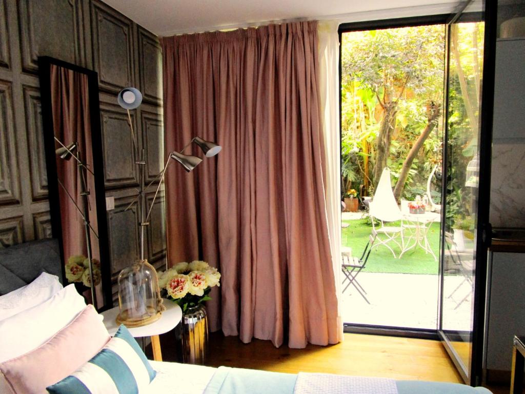 a bedroom with a bed and a sliding glass door at The Gallery Studios in Porto