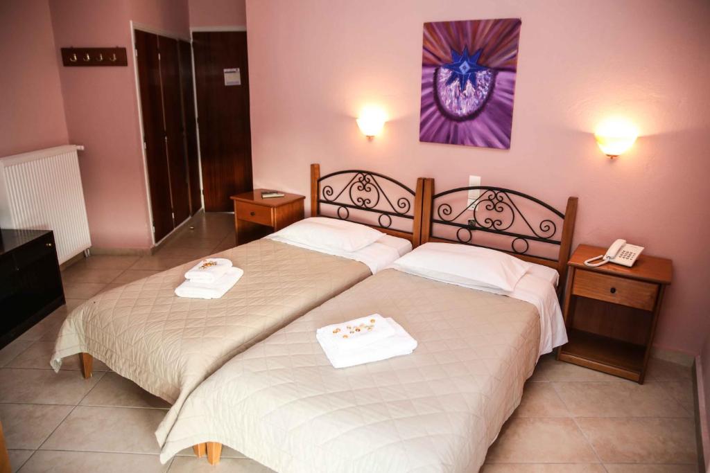 Postel nebo postele na pokoji v ubytování Anixis Hotel