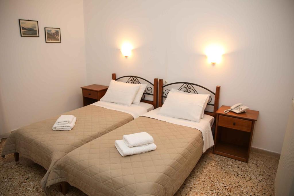 Postel nebo postele na pokoji v ubytování Anixis Hotel