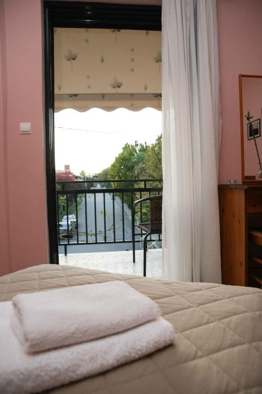 Postel nebo postele na pokoji v ubytování Anixis Hotel