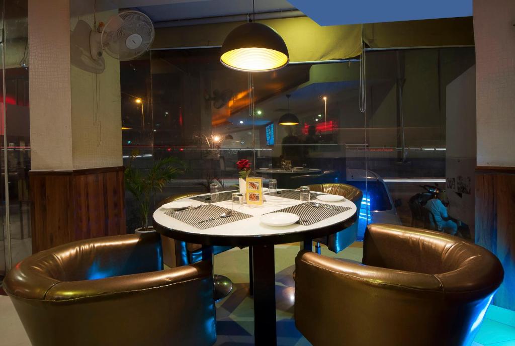 Uma área de estar em Airport Hotel Ramhan Palace Mahipalpur