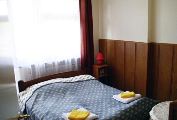 Posteľ alebo postele v izbe v ubytovaní Hotel Bona